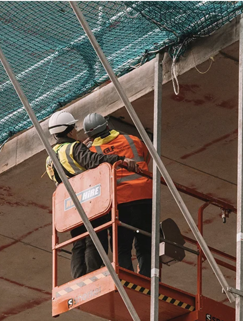 Crew working from a lift on a commercial job site